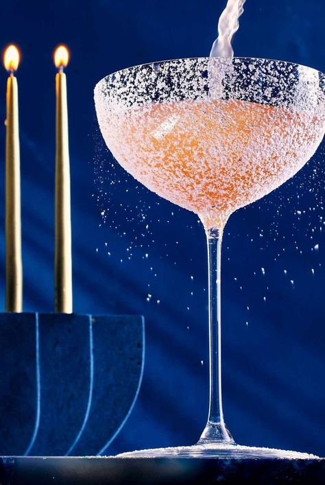 Naomi Levy’s Hebrew Hammer is a fruity, bright pink Hanukkah cocktail that uses framboise to mimic the flavors of sufganiyot, Israeli doughnuts. #cocktails#cocktailrecipes#drinks#drinkideas#drinkrecipes#drinkalcoholrecipes #holidayrecipes #holidaycocktails #hanukkahcocktails #vodkacocktails Hanukkah Cocktails, Chanukah Cocktails, Fig Syrup, Simple Syrup Cocktails, Clear Fruit, Whiskey Smash, Sweet Bourbon, Hanukkah Party, Jewish Cuisine