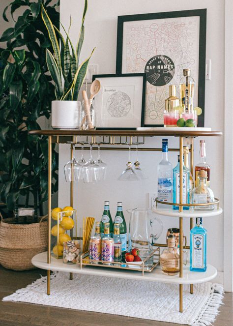 Brooklyn Apartment // Bar Cart Styling Three key elements to styling a functional and chic bar cart! Mid-Century modern decor, colorful, apartment living, NYC.... #homedecor #interiordecorating #barcartstyling #barcart #westelm #westelmbarcart #betterhomesandgardens #home #apartment #nycapartment #brooklynapartment #bloggerstyle #bloggerhomeinspo #interiordesign #interiorinspo #bloggerhome #apartmentstyle #smallspace #midcenturymodern #modernhome #baraccessories #barware #summercocktails Chic Bar Cart, Apartment Bar, Modern Apartment Decor, Blogger Home, Bar Cart Styling, Bar Cart Decor, Apartment Style, Mid Century Modern Decor, Interior Inspo