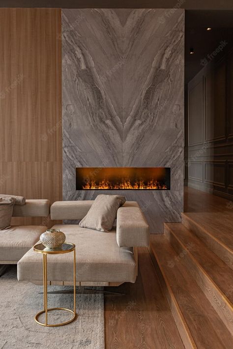 Premium Photo | Living room marble wall fireplace and stylish bookcase in chic expensive interior of luxury country house with a modern design with wood and led light gray furniture with gold elements Luxury Fireplace, Living Room Marble, Stone Wall Design, Transitional Chandelier, The Melody, Grey Furniture, Living Room Scandinavian, Marble Fireplaces, Modern Fireplace