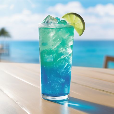 Mermaid Blue Cocktail Recipe - The Mermaid Blue cocktail offers a refreshing, citrusy taste with a sweet and slightly spicy undercurrent from the ginger beer. The vodka provides a smooth, strong backbone, while the blue curacao imparts a sweet orange flavor and the signature blue hue. Curacao Drink, Blue Curacao Drinks, 21 Dinner, Blue Drink, Cocktail Ideas, Blue Drinks, Colorful Drinks, Colorful Cocktails, Fresh Drinks