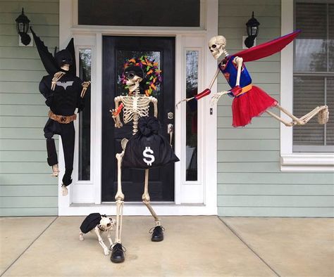 The skeletons, and dog Fang, are also superheroes, seen here stopping a robber. Outdoor Skeleton, Porche Halloween, Couples Decor, Halloween Skeleton Decorations, Halloween Outside, Casa Halloween, Dog Skeleton, Skeleton Decorations, Adornos Halloween