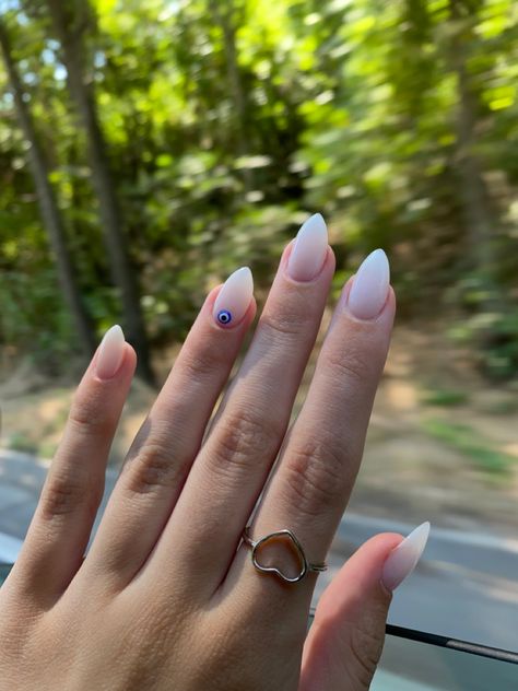 Summer Nails 2023 Milky White, White Nails Evil Eye Design, Almond Nails Designs Milky White, The Evil Eye Nails, Milky White Nails Evil Eye, Blue Eye Nail Design, Nails With Greek Eye, Evil Eye Accent Nail, Milky White Almond Nail Ideas