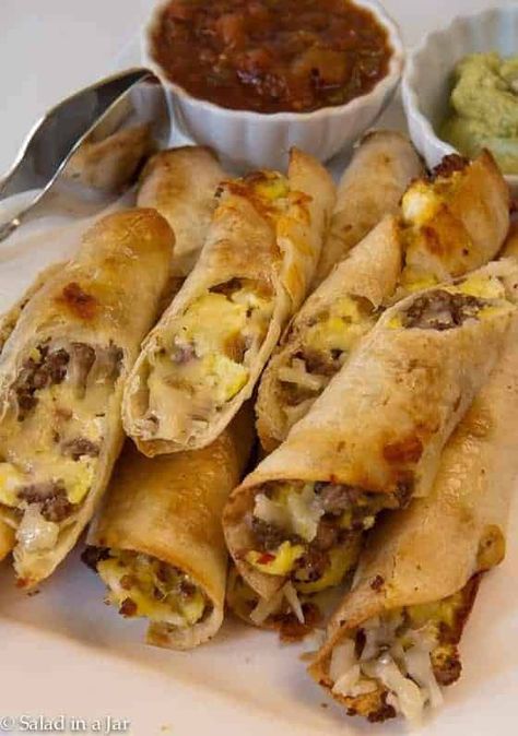 Flour tortillas filled with scrambled eggs and sausage--baked in the oven until tortillas are crispy Egg And Sausage Breakfast, Breakfast Taquitos, Spinach And Eggs Breakfast, Egg And Sausage, Crispy Egg, Sausage Bake, Breakfast Bites, Breakfast Sausage, Turkey Bacon