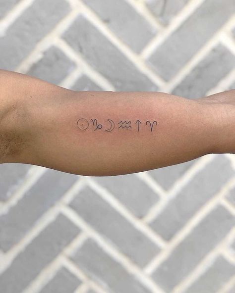 Tiny Zodiac signs by Loz Thomas inked on the left bicep Sun Moon And Rising Tattoo, Moon Rising Tattoo, Sun Moon Rising Tattoo, Zodiac Sun Moon Rising, Dainty Tats, Anniversary Tattoos, Rising Tattoo, Sun Tattoo Meaning, Simple Sun Tattoo