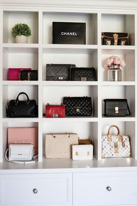 In a small closet alcove, designer bags sits in built in purse shelves positioned above white drawers donning polished nickel knobs. Handbag Display, Bag Closet, Walking Closet, Purse Storage, Handbag Storage, Closet Decor, Dream Closets, Small Closet, Glam Room