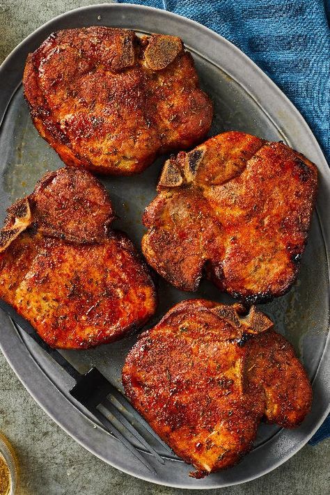 Smoked Pork Chops | "You don’t have to be an expert smoker to make tender, expertly seasoned smoked pork chops. Our recipe works for beginners and pros. The seasoning mixture and overnight sitting will make the best crust possible, which will make the smoking process go smoothly. Serve with red wine, roasted veggies, salad, and cold beer." #porkrecipes #porkdishes #pork #porkchops #porkchoprecipes #dinner #dinnerrecipes Veggies Salad, Pellet Smoker Recipes, Smoked Pork Chops, Pellet Grill Recipes, Traeger Recipes, Smoked Meat Recipes, Smoked Cooking, Chops Recipe, Smoked Pork