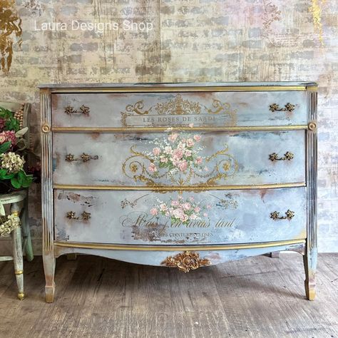 Make your furniture feel fancy with the Kacha Les Roses rub on transfer for furniture and crafting! This furniture transfer features oh-so-pretty French script and intricate scroll work in gold with bouquets of colorful pink roses. Add some je ne sais quoi to any surface with style and ease! Easily transform your project into a professional-looking work-of-art. No water needed; no prepping needed. Use it on any smooth surface, dressers, mirrors, cabinets, doors, or canvas and fabric. The possibi Furniture Transfers Vintage, Lace Painted Furniture, Transfers On Furniture, Kacha Furniture, Diy Decoupage Furniture, Furniture Flipping Ideas, Dressers Mirrors, French Provincial Bedroom Furniture, Decoupaged Furniture