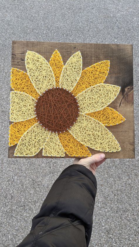 "Add some sunflower brightness to your room with this unique string art sign. Standard sign details as seen in the first photo. -Size: 11.5 square -Wood finish: Dark Walnut Stain -String color as pictured. Made to order signs can be customized, add a note in the personalization section to make the sign unique to you. This is a made to order sign - I work hard to create your orders and get them shipped as quickly as possible, but please allow standard of 1-2 weeks for your item to be handcrafted Mail String Art, Large String Art, Hands On Art Projects, Nail Yarn Art, String Art Szablon, Nail String Art Template, Sunflowers Decorations, Diy Sunflower Decor, Wood Nail Art