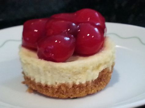 These are festive little cakes After cooled garnish with a sprinkle of cake sprinkles or get creative and use fresh berries; fresh sliced fruits; toasted coconut..... Prep time unknown; baking time 20 minutes THE BORDENS EAGLE BRAND CONDENSED MILK PROVIDES THE SWEETNESS TO THE CHEESECAKE MIXTURE...SUGAR IS NOT NEEDED. (except for stated amount in crust.) Miniature Cheesecakes, Mini Cherry Cheesecakes, Cherry Cheesecake Recipe, Mini Cheesecake Bites, Mini Cheesecake Recipes, Cheese Tarts, Cheesecake Cupcakes, Cheesecake Filling, Cherry Cheesecake