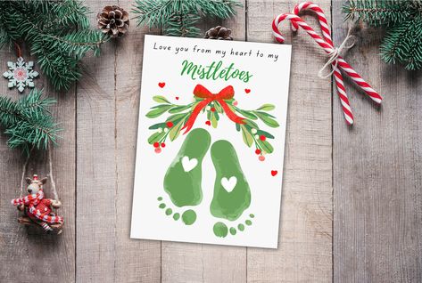 Spread holiday cheer with our Mistletoe Christmas Footprint Handprint Craft! 🎄✋ Engage kids in a festive and creative school activity, creating delightful holiday DIY cards. This craft transforms into a memory keepsake and thoughtful gift, capturing the magic of the season. Utilize the printable template to make it a hassle-free and joyful art project for kids. Craft memorable moments together this holiday season! 🌟👶 #ChristmasCrafts #HandprintCraft #DIYHolidayKeepsake Miseltoe Crafts For Kids, Mistletoes Craft, Christmas Handprints, Mistletoes Footprint, Mistletoe Craft, Mistletoes Footprint Craft, Christmas Footprint Crafts, Mistletoe Footprint, Christmas Footprint