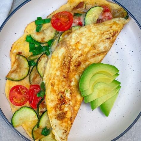 Tomato & Zucchini Omelette | 28 By Sam Wood Zucchini Omelette Recipe, Zucchini Omelette, Omelette Recipes, Eggs And Mushrooms, Sam Wood, Zucchini Tomato, Omelette Recipe, Veggie Meals, Savoury Recipes