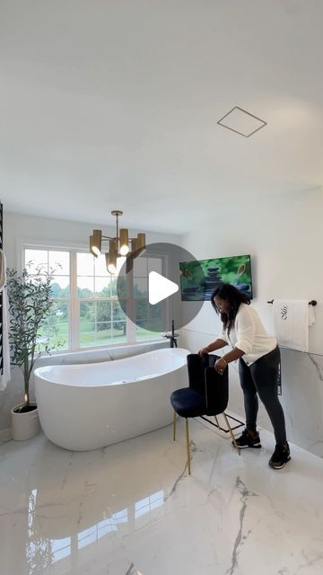 Moji Ojediran Interior Design | Home Decor | Lifestyle on Instagram: "Happy February! So, when I first shared this bathroom space with these chairs, I received some interesting comments 😂. Some people didn’t quite get it. The ones that get it, get it and the ones that don’t, don’t 😉. We all have different tastes, and that’s what makes life interesting!  If you have a stunning window vista, would you  create a cozy seating area for you and your spouse to soak it all in?

My absolute favorite feature here is the tub and tub filler with a built-in table! Such a neat idea 👌🏾.

.
.
.
.
.
.
.
#bathroomdesign #bathroomdecor #interiordesign #bathroomremodel #bathroomstyling #bathroominspiration #amazonfinds #bathroomgoals #bathroomrenovation #amazonhome #masterbathroom #bathroomdesign #bathroo Mirrors In Bathrooms, Two Shower Heads, Cozy Seating Area, Framed Mirrors, Happy February, Wet Room, Bathroom Redesign, Metal Frame Mirror, Dead Space