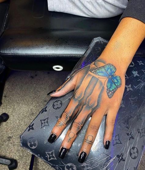 ✨🥶DM FOR PROMOS✨🥶GOT DRIP?🥶 on Instagram: “💙🦋Hand Tattoos🦋💙 . This App Literally Gives Away Gift Cards & Teach U About Money💰👉🏾👉🏾 . Turn On My Post Notification🔔📱 . DM FOR CHEAP…” Butterfly Skull Hand Tattoo, Skull Hand Tattoo For Women, Pretty Face Tattoos, On Hand Tattoo, Small Dope Tattoos, Best Neck Tattoos, Butterfly Hand Tattoo, Skull Hand Tattoo, Hand Tattoos For Girls