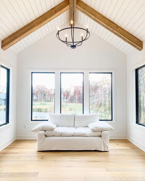 Wood Pitched Ceiling, Trey Ceiling With Wood Beams, White Shiplap Ceiling With Wood Beams, Planked Ceiling With Beams, Shiplap Ceiling Vaulted With Beams, White Beam Vaulted Ceiling, Vaulted Ceiling Square Windows, Black Picture Window, Vaulted Ceiling Windows