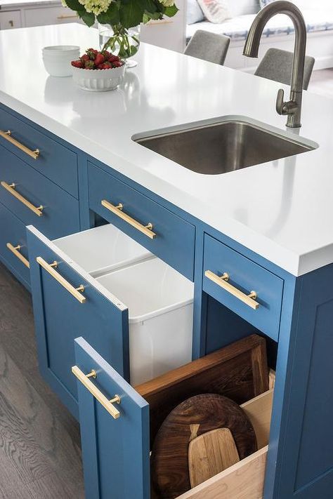 A curved stainless steel prep sink paired with a satin nickel gooseneck faucet is fixed to a white quartz countertop contrasting a Benjamin Moore Van Deusen Blue island adorned with Lewis Dolan brass pulls. Blue Kitchen Island, Kitchen Island With Sink, Unique Kitchen Design, Sink In Island, Prep Sink, Space Saving Kitchen, Transitional Kitchen, Blue Kitchens, Unique Kitchen