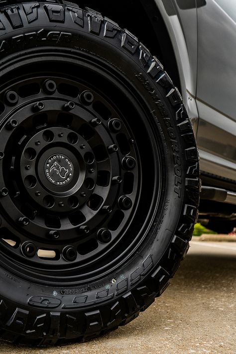 This 2020 Ford F150 XLT took a dip in our paint department to receive a matching set of painted lead foot mirror caps, grille inserts, and magnetic metallic badges. We fitted it with a 2-inch lift kit, 20-inch Black Rhino Arsenal wheels, and Nitto Ridge Grappler tires. We finished it off with a spray-in bed liner and UltraFlex Tonneau Cover, making this build a match made in heaven for any F150 enthusiast. Black Ford F150, F150 Mods, Ford F150 Interior, Truck Rims And Tires, 2020 Ford F150, Old Toyota, F150 Accessories, Ford F150 Lariat, Nitto Ridge Grappler