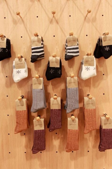 Our ingenious sock display pegboard! Wood Peg Hooks, Sock Display, Sock Store, Display Retail, Trelise Cooper, Peg Hooks, Socks Packaging, Visual Merchandising Displays, Craft Show Displays