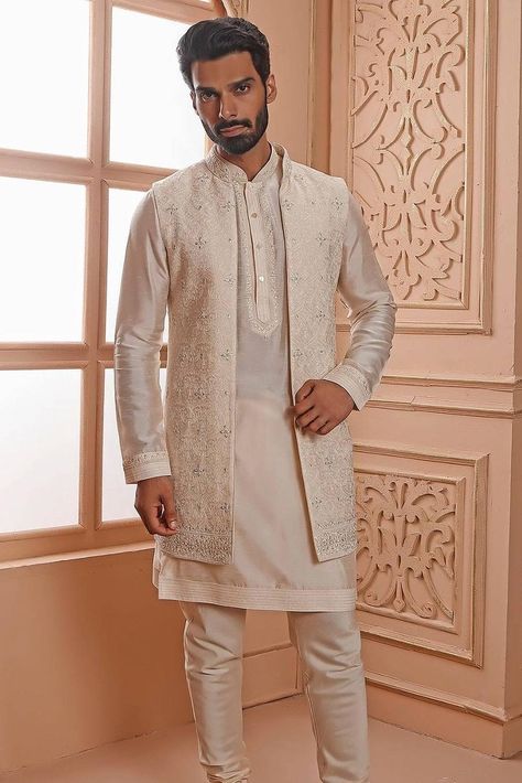 Whether you are planning to attend a friend’s Mehndi or going to a Sangeet ceremony, a kurta with jacket for men is more versatile than your usual run-of-the-mill options. Here's how! Kurta For Sangeet Men, Kurta With Long Jacket For Men, Jacket Kurta For Men, Kurta With Jacket For Men, Long Jacket For Men, Kurta With Jacket, Groom Clothes, Grooms And Groomsmen, Sangeet Ceremony