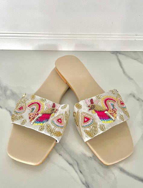 Embroidered Summer Sandals with Bird and Floral Motifs, Threadwork and Beadwork | Women's Punjabi Jutti, Slip On Sandals, Dressy Sandals I am loving these funky beige slide-on summer sandals, in the Punjabi jutti style embroidery for the summer. These sandals bird motifs made by sequins, threadwork and bead work. These sandals are a HOT buy, get them in time for your summer weddings so that you can dance the night away in comfort! Perfect for a sangeet/mehndi function. Made on imitation leather Jutti Punjabi, Embroidery Sandals, Mehndi Function, Fancy Sandals, Punjabi Jutti, Dressy Sandals, Bird Motif, Bird Embroidery, Slip On Sandals