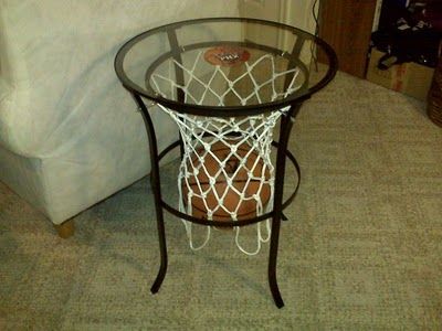 Materials: Ikea table, small hooks, long skinny hooks, basketball net, magnet of your favorite team, super glue, black spray paint, a saw to cut off the flowery part, rubber feet to make it into a trivet Room Basketball Ideas, Basketball Furniture, Diy Basketball Room Decor, Diy Basketball Lamp, Basketball Man Cave, Basketball Lamp, Basketball Bedroom, Basketball Room, Man Cave Basement