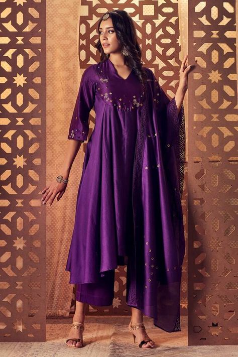 Purple anarkali with zari, gems and studs embroidery. Paired with flared palazzo and embroidered dupatta with crochet lace. Component: 3 Pattern: Embroidered Type Of Work: Stud,Zari,Gems Neckline: V Neck Sleeve Type: Long Sleeves Fabric: Kurta and Dupatta: Chanderi, Lining and Palazzo: Cotton Color: Purple Other Details:  Lace hem dupatta Metallic embroidery Note: Bag shown in the image is not for sale Occasion: Sangeet - Aza Fashions Luxury Purple Dola Silk Anarkali Set, Luxury Purple Anarkali Set For Navratri, Luxury Purple Traditional Wear For Diwali, Luxury Purple Traditional Wear For Festive Occasions, Luxury Purple Floor-length Traditional Wear, Luxury Purple Kurta For Diwali, Luxury Fitted Purple Anarkali Set, Affordable Purple Traditional Wear For Diwali, Luxury Embellished Purple Anarkali Set