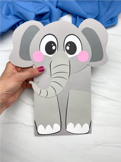 How cute is this! Make your own elephant paper bag puppet craft with our free template. This craft would be perfect for preschool and kindergarten children to use in zoo animal units. Recycled Animals, Elephant Puppet, Paper Bag Puppet Craft, Elephant Craft, Puppet Template, Elephant Template, Zoo Animal Crafts, Bag Puppet, Circus Crafts