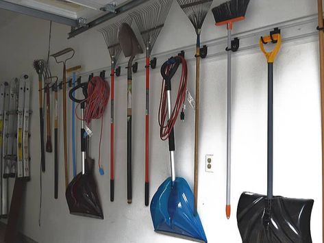 wall of neatly organized yard rakes, shovels and brooms Garage Organization Shovels Rakes, Rake And Shovel Storage Garage Walls, Garage Shovel Organization, Broom Storage Garage, How To Organize Shovels And Rakes, Garage Rake And Shovel Storage, Garage Shovel Storage, Shovel Organization Storage Ideas, Shovel And Rake Storage Ideas