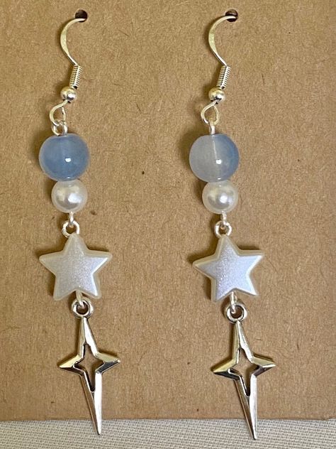 🌠a pair of y2k light blue dangle earrings 🪩handmade with love and packaged with care :D earrings backs and freebie stickers included 🤍thanks for visiting my shop Silver Y2k Earrings, Diy Blue Earrings, Star Bead Earrings, Homemade Earring Ideas, Easy Jewelry Diy, Homemade Jewelry Ideas, Y2k Light Blue, Freebie Stickers, Silver Y2k