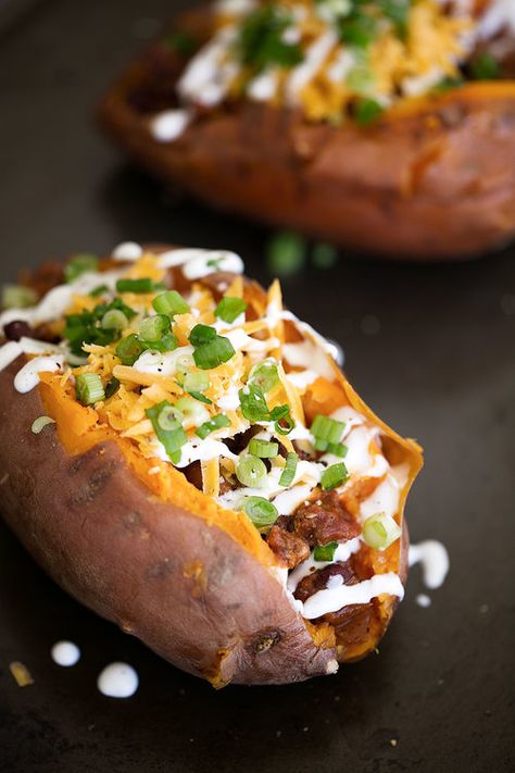 chili loaded baked sweet potatoes topped with cheddar cheese sour cream green onions Loaded Baked Sweet Potato Recipes, Baked Sweet Potato Recipes, Loaded Baked Sweet Potato, Baked Sweet Potatoes, Bruschetta Ingredients, Loaded Sweet Potato, Top Chicken Recipes, Baked Potato Recipes, Loaded Baked Potatoes