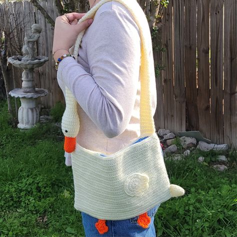 Me outside wearing a long sleeve shirt and jeans, crochet goose bag on my shoulder Goose Purse Crochet, Crochet Goose Bag Pattern Free, Goose Bag Crochet, Crochet Duck Bag, Goose Purse, Goose Bag, Crochet Goose, Duck Bag, Bag Pattern Free