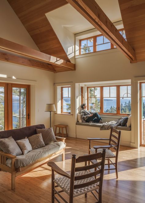 This open planned living room with cathedral ceilings and exposed collar ties of locally milled fir also contains a nifty window seat that allows abundant winter sun. Cathedral Ceiling Living Room, Lakehouse Kitchen, Vaulted Ceiling Living Room, Cabin Interiors, Open Living Room, Luxury Homes Interior, Beautiful Living Rooms, Cathedral Ceiling, Prefab Homes