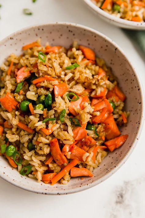 This crispy salmon fried rice is a flavorful and veggie-packed main dish! It's nutrient-dense, gluten-free, and can be made grain-free. Nutrient Dense Dinner, Salmon Fried, Salmon Fried Rice, Dinner Fish, Unbound Wellness, Crispy Salmon, Raw Cauliflower, Paleo Main Dishes, Making Fried Rice