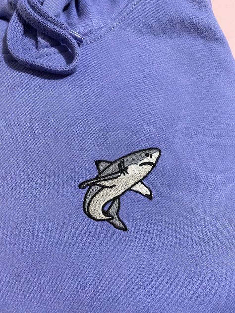 Embroidered 'Shark' Hoodie with left sleeve embroidery! Our 300gsm Hoodies are made of 50% Cotton and 50% Polyester! And our new 280gsm hoodies are 80% Ringspun Cotton and 20% Polyester and are Vegan Approved!! Multiple sizes available from Small to XXL Please check the size guide in the photos before purchasing Embroidery Shark, Shark Things, Shark Clothes, Shark Embroidery, Bone Bordado, Shark Fish, Shark Pictures, Painting Hoodie, Shark Tee