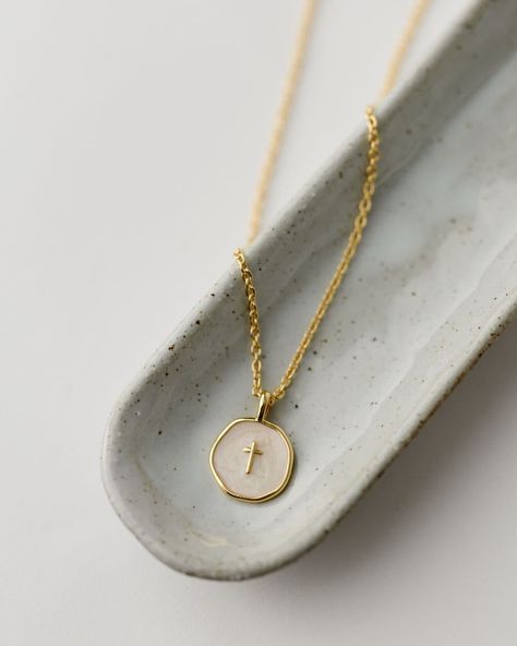 Sure to be a new customer favorite, our Emily Necklace is a modern addition to our spiritual jewelry line. We love with the dainty ivory and gold enamel disc with tiny gold cross for Easter and Confirmation gifting, but don't forget to grab one for yourself, too! Details: Gold plated brass 16" chain with 2" extender Handmade in Haiti Gold-plated and ivory enamel cross pendant Emily Necklace, Faith Based Jewelry, Enamel Cross, Modern Addition, Gold Cross Necklace, Gold Cross, Gold Enamel, Spiritual Jewelry, Black Enamel