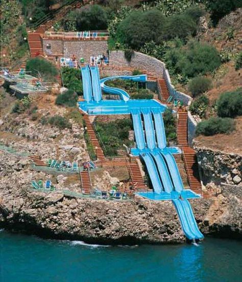 At the Citta del Mare hotel in Sicily, you can slide right into the Mediterranean Sea. Sicily Hotels, Taman Air, Nature Park, Holiday Resort, Sicily Italy, The Windy City, Water Slide, Vacation Places, Mediterranean Sea