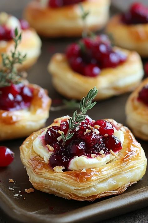 Cranberry Brie Puff Pastry Bites, an elegant holiday appetizer featuring soft cheese and cranberry sauce wrapped in flaky pastry, ideal for festive gatherings. Christmas Appetizers Brie Bites, Brie Wreath Appetizer Puff Pastry, Cranberry Bites Brie, Cranberry Pecan Brie Bites, Cranberry Baked Brie Puff Pastry, Christmas Brie Bites, Brei Cranberry Bites, Gluten Free Cranberry Brie Bites, Cranberry Brie Cups Appetizer