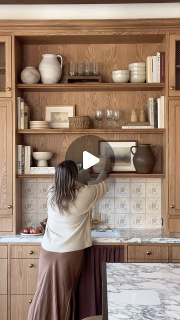 Shoppe Amber Interiors on Instagram: "How we like to style our kitchen shelves ✨  + add artwork for an unexpected personal touch  + use cookbooks as decor, mixing stacks vertically and horizontally for a balanced look  + create visual interest by varying the heights of items on your shelves  + mix textures like smooth ceramics and woven baskets to add depth   The best part? You can easily swap out items as the seasons change, as your curate new pieces in your collection, or as you simply just need a refresh!" Built In Shelves Kitchen, Kitchen Shelves Decor, Add Artwork, Kitchen Shelf Styling, Kitchen Shelf Decor, Style Pantry, Shoppe Amber Interiors, Pantry Shelf, The Heights