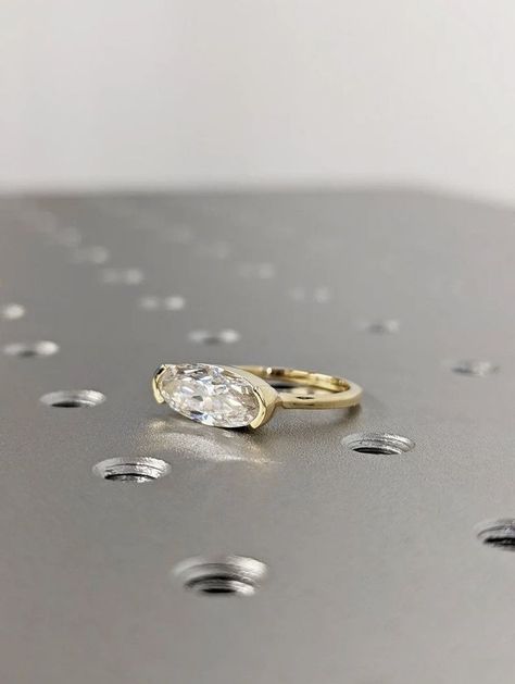 East West Oval Moissanite half bezel set Solitaire Engagement Ring ,14k Yellow Gold Elongated Moissanite Wedding Ring, Moissanite Solitaire Center BRAVERMAN Moissanite Cut : Oval Shape Cut Total Carat : 2.2CT Color : D Clarity : VVS #14k #yellow #gold #diamond #ring #east #west #oval #ring #jewelry #moissanite #oval #cut #moissanite #oval #ring #oval #moissanite #wedding #ring #half #bezel #ring #engagement #ring #oval #solitaire #promise #ring #oval #cut #ring Moval Engagement Ring, Half Bezel Ring, Half Bezel Setting, Half Bezel, Bezel Engagement Ring, Oval Diamond Ring, Oval Moissanite, Bezel Ring, Ring Moissanite