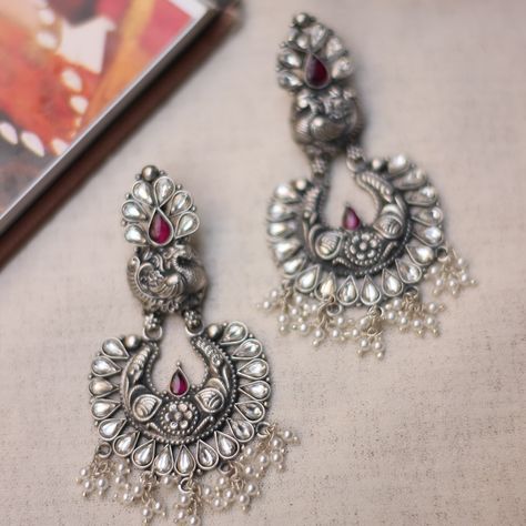 Elevate your Navratri look with our stunning silver oxidized earrings! Perfectly crafted to complement your festive spirit, these earrings blend tradition with modern elegance, making sure you shine bright through every garba twirl. Complete your ethnic ensemble with a timeless touch of grace. Prefer a closer look? Book a video call for a showcase of our exquisite pieces. And if you fancy a physical experience, visit us at Jewel Box By Arnav, located at Bodycraft Complex, 1st Floor, 100 Feet... Jewel Box, Shine Bright, Lookbook, Silver