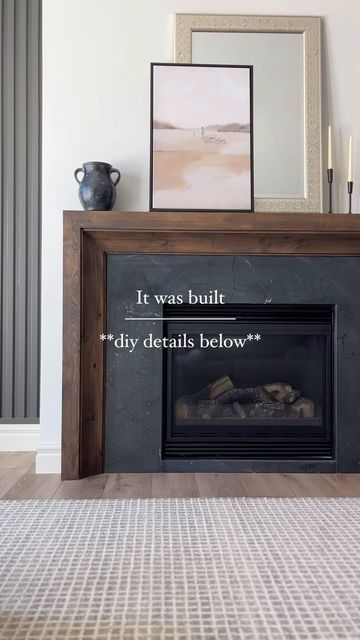 Andrea Nelson | Home Decor | Interior Decorating on Instagram: "How to DIY our fireplace mantle ⤵️  I get messages from people requesting the link to our mantle regularly.   It’s custom built by professional finish carpenters, but I’m going to give you all the info to DIY.  We had the BEST finish carpenters in all the land @awesometrimwork working on our home, and they custom built our mantle for a look we loved and so that we could match it to the wood beam and kitchenette wood stain we put in down there.  So… I reached out to thfor the details, and here’s what they said:  “We built the mantle using Clear Alder. It’s a pretty simple but sleek design. We ordered a 6” cove crown moulding from a local mill and ran that on the inside of our outer box. Then added a cleat for the inside of the Fireplace Shelves One Side, Replacing A Fireplace Mantle, Mantle Surround Diy, Easy Fireplace Mantle Diy, Built In Fireplace Mantle, Fireplace Mantle No Fireplace, Custom Wood Fireplace Mantel, Wood Mantle Surround, Fireplace On Flat Wall Mantles