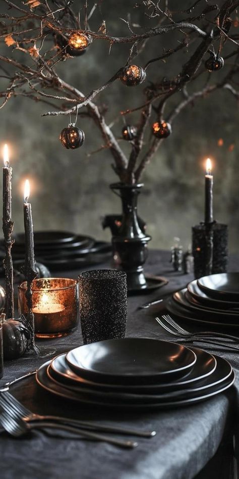 Unleash spine-chilling style with these Halloween table decorations! Create a vampire's feast using deep red velvet as a tablecloth. Add black lace table runners for contrast. Use silver candelabras with blood-red candles. Place ornate goblets filled with cranberry juice for a bloody effect. Add vintage frames with spooky portraits as centerpieces. Use bat-shaped napkin holders and place cards written in gothic script. Your Halloween table will exude an air of elegant terror! Diy Vampire Decorations, Goth Table Setting, Gothic Dinner Party Table Settings, Vampire Tablescape, Halloween Tablescape Elegant, Vampire Dinner Party Table Settings, Goth Dinner Table, Candelabra Halloween, Spooky Portraits