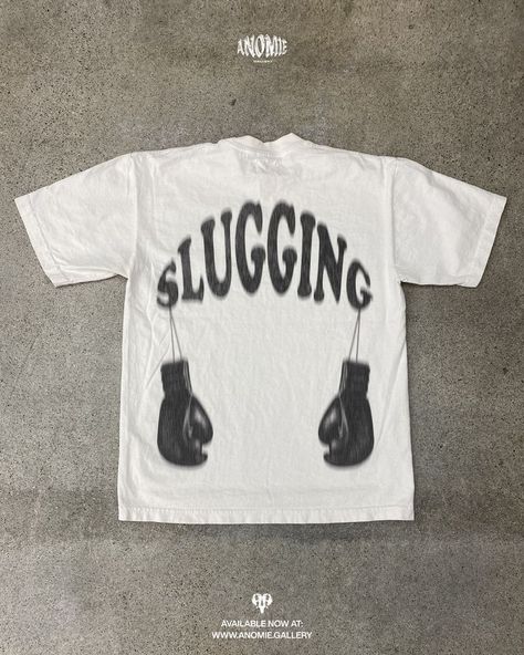 Discover the latest in male streetwear with this unique boxing graphic shirt, the Slugging Tee. Merging the worlds of boxing and archive fashion, it's the ultimate piece for any modern fashion-forward individual. Boxing Graphic, Boxing Clothes, Male Streetwear, Boxing Shirts, Apparel Design Inspiration, Streetwear Graphic Tees, Boxing Club, Archive Fashion, Boxing T Shirts