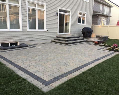 Pavers Around Deck, Backyard Step Down Patio Ideas, 2 Level Paver Patio Ideas, Step Down Patio Backyards, Patio Along Back Of House, Patio Stone Steps, Backyard Concrete Patio Ideas With Steps, Backyard Patio With Steps From House, Pacer Patio Ideas