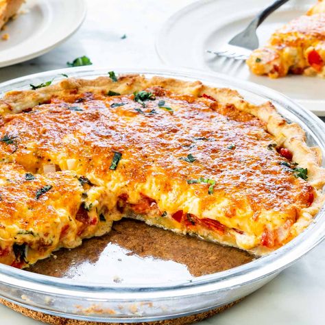 Hands up if you're ready to slice into this Tomato Pie! This will be a top contender on your list of dinnertime favorites. #tomatopie #tomatoes #pie #cheese #recipe Bisquick Tomato Pie Recipe, Paula Deen Tomato Pie, Tomato Pie Recipe Easy, Recipe With Eggs, Tomato Pie Recipe, Leftover Pie, Trinidad Recipes, Buttery Pie Crust, Fresh Tomato Recipes