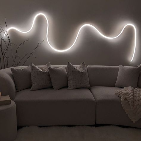 Warm white wall LED Rope light 5 meters in a luxury living room with a cream modern sofa. Led Strip Wall Design, Led Wall Art Living Room, Rope Lights Living Room, Squiggle Lights, Led Rope Lights Living Room, Rope Lighting Ideas, Light Strip Ideas, Govee Led Rope Ideas, Led Rope Lighting Ideas