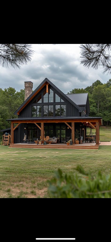 Old Farmhouse Barndominium, Dark House With Cedar Accents, Small Black Barndominium Ideas, Exterior Cabin Design, Barndominium Black Exterior, Black House With Wrap Around Porch, Dark Barndominium Ideas, Black And Brown Barndominium, Dark Green Barndominium