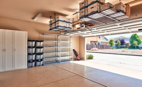 Garage with storage cabinets and overhead ceiling racks Garage Storage Plans, Garage Ceiling Storage, Garage Storage Inspiration, Storage Hacks Diy, Garage Storage Ideas, Garage Diy, Overhead Garage Storage, Garage Storage Shelves, Overhead Garage