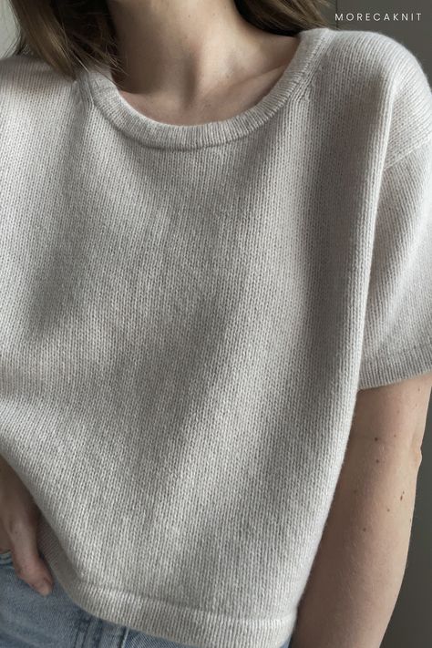 This contemporary knit embodies elegance with its understated aesthetic and soft cashmere yarn. Designed with an oversized and slightly cropped fit, it's enriched with drop shoulders and a classic rounded neck. Worked from the bottom up, it integrates a folded hem and the advanced Sloped Bind-Off technique, ensuring a polished finish. Its simplicity allows seamless integration into any wardrobe. Explore more designs and follow our profile for updates. Pattern available via link. Knit Folded Hem, Tees Pattern, Cashmere Yarn, Bind Off, Oversize Knit, Contemporary Chic, Sweater Knitting Patterns, Knit Tees, Knitting Projects