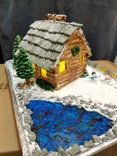 Had fun making this with large pretzel log, jolly rancher lake and frosting snowmen Pretzel Cabin, Homemade Gingerbread House, Gingerbread House Designs, Gingerbread House Decorations, Christmas Gingerbread House, Jolly Rancher, Cabin In The Woods, Christmas Gingerbread, Cabins In The Woods