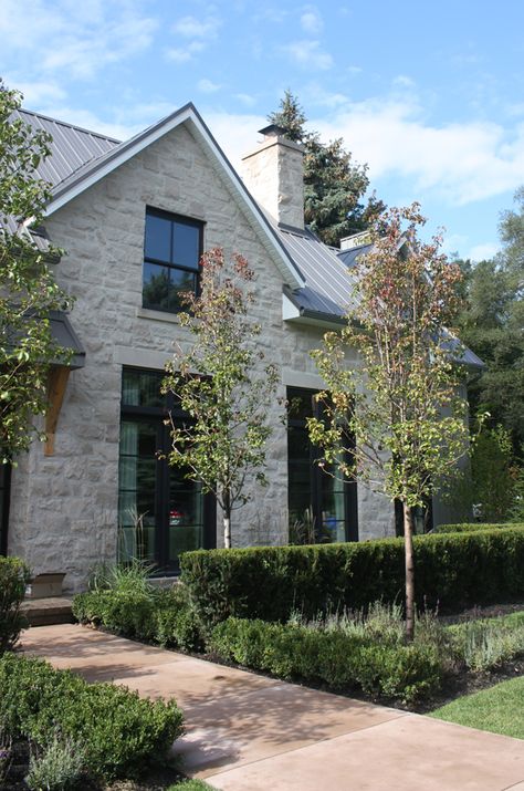 Great Farmhouse- limestone, tin roof, black windows, I love just about everything about this house. New house that looks like it's been there forever :) Modern Limestone Exterior, Urban Farmhouse Exterior, Rock Exterior, Modern Farmhouse Exterior Design, Rustic Farmhouse Exterior, Farmhouse Exterior Design, Exterior Design Ideas, Urban Farmhouse, Casas Coloniales